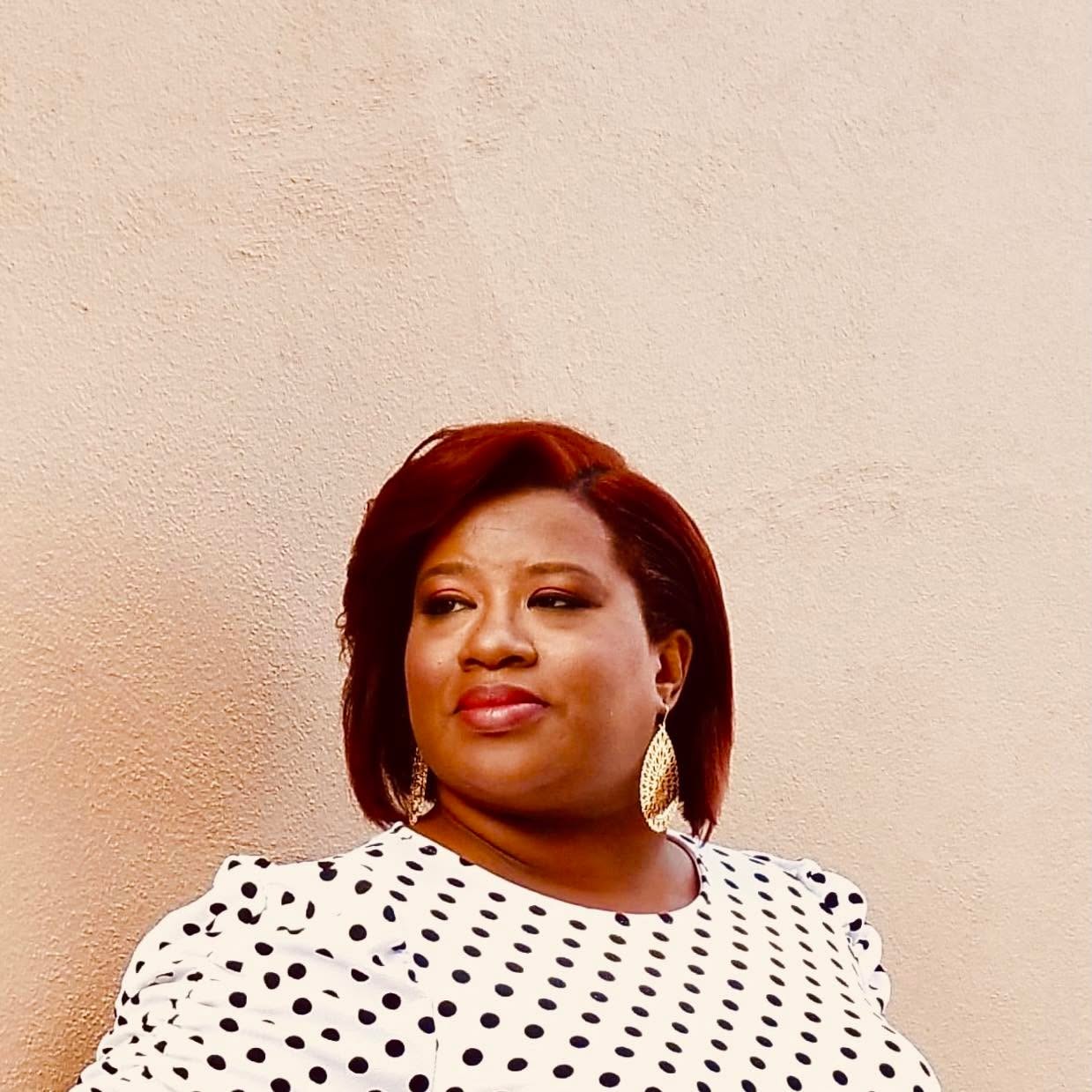 Shani, coach, facilitator, and preacher, in warm natural light